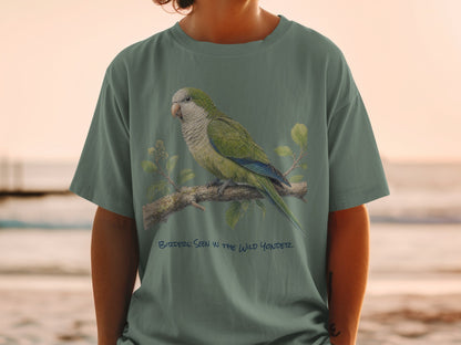 Green t-shirt with a parrot on a branch and text "BITZDERS: SEEN IN THE WILD YONDER".
