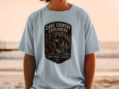 Cave Country Explorers shirt with a cave explorer, water, and stalactites graphic.
