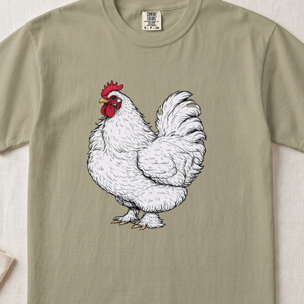 Olive green crewneck t-shirt featuring a detailed illustration of a white rooster centered on the chest.
