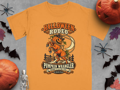 Orange t-shirt with "Halloween Rodeo Pumpkin Wrangler" graphic.