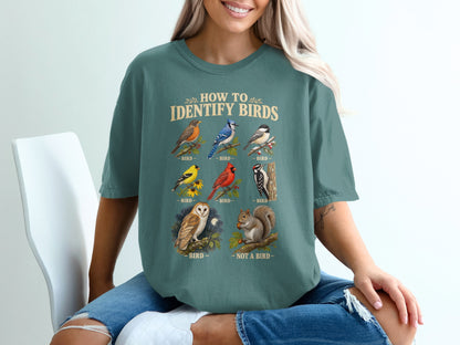 T-shirt with "How to Identify Birds" text and illustrations of various birds and a squirrel.