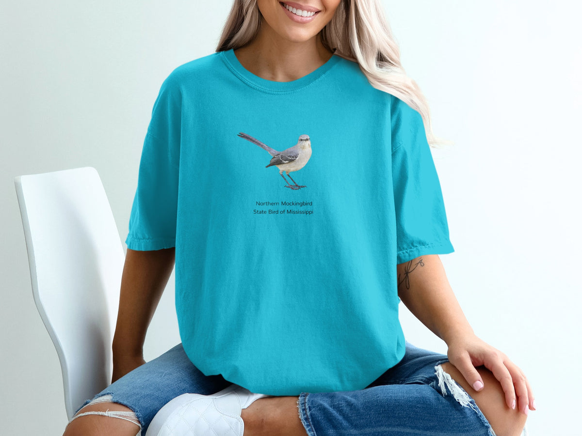 Northern Mockingbird, State Bird of Mississippi graphic on teal t-shirt.