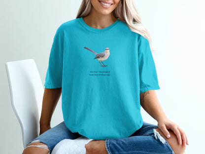 Northern Mockingbird, State Bird of Mississippi graphic on teal t-shirt.