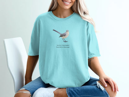 Teal t-shirt with Northern Mockingbird, state bird of Mississippi graphic.