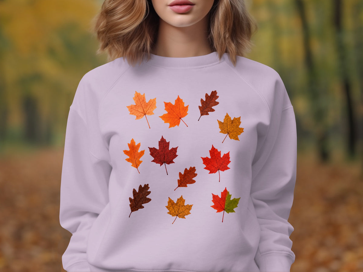 Lavender sweatshirt with a scattered pattern of colorful fall leaves.