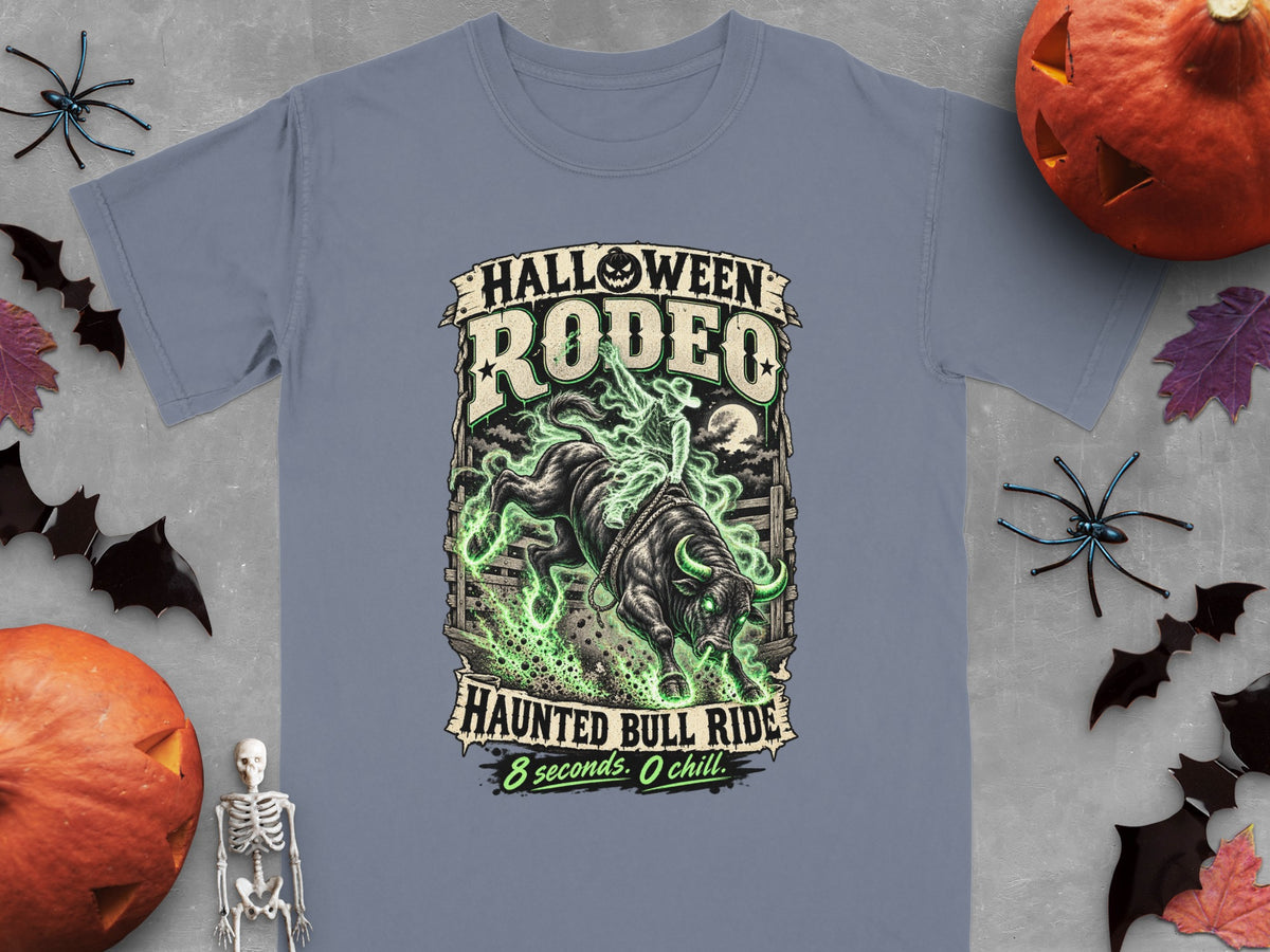 T-shirt with Halloween Rodeo graphic of a rider on a bull surrounded by green glow.