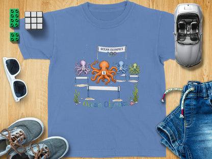 Four octopuses race under an "Ocean Olympics" banner, with numbers 1-4 on their chests.