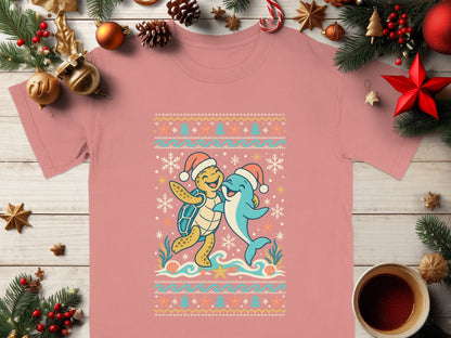 T-shirt with a Christmas-themed sea turtle and dolphin graphic.
