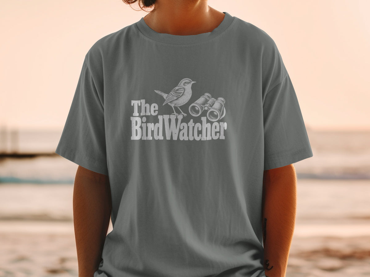 Grey t-shirt with white text and graphic of a bird and binoculars.