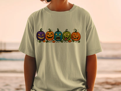 T-shirt with a row of five jack-o'-lanterns with various funny expressions.