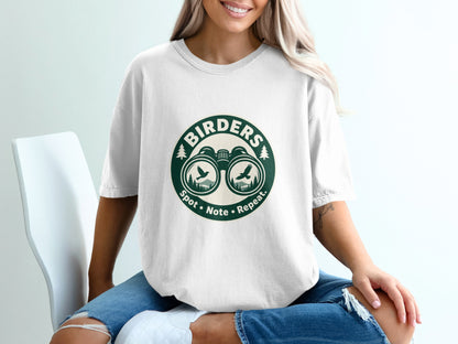 White t-shirt with green circular "Birders Spot Note Repeat" logo featuring binoculars and birds.