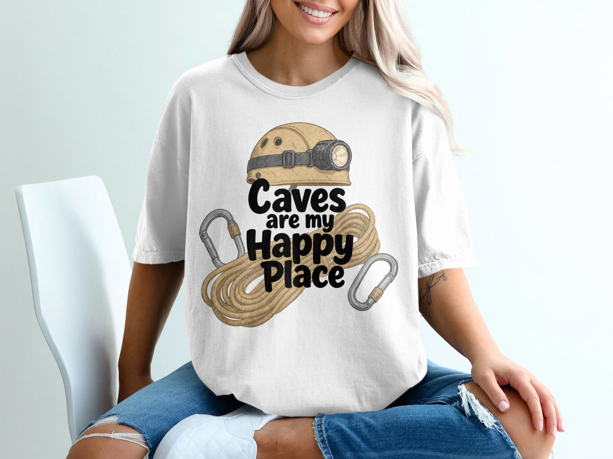 White t-shirt with text "Caves are my Happy Place" and caving gear illustration.