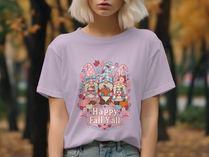 Gnomes with pumpkins and text reading "Happy Fall Y'all" on a light purple t-shirt.