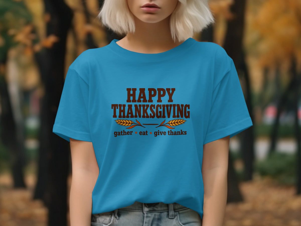 Blue t-shirt with "Happy Thanksgiving gather eat give thanks" text.