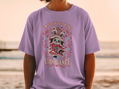 Panda in a lion dance costume on a purple t-shirt with "I'M JUST HERE FOR THE LION DANCE" text.
