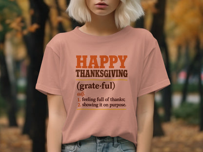 Peach t-shirt with "Happy Thanksgiving (grateful)" definition print.
