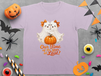 Light purple t-shirt with two ghosts hugging over a pumpkin and text "Our Time of the Year, at Last!".