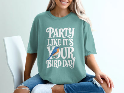 Teal t-shirt with white text "PARTY LIKE IT'S YOUR BIRD DAY" and a bluebird.