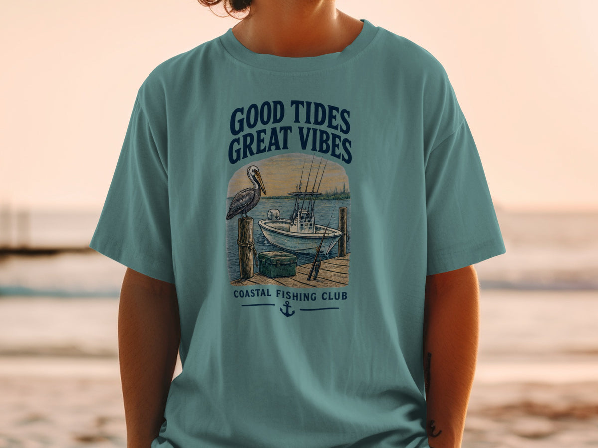 Teal t-shirt with "Good Tides Great Vibes" and fishing boat graphic.