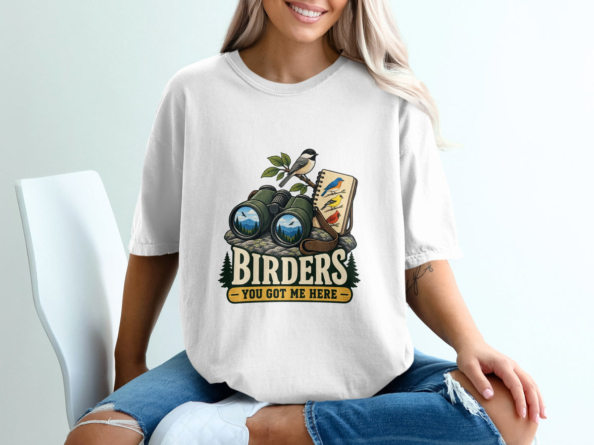 White t-shirt with binoculars, bird on branch, and text "BIRDERS YOU GOT ME HERE".