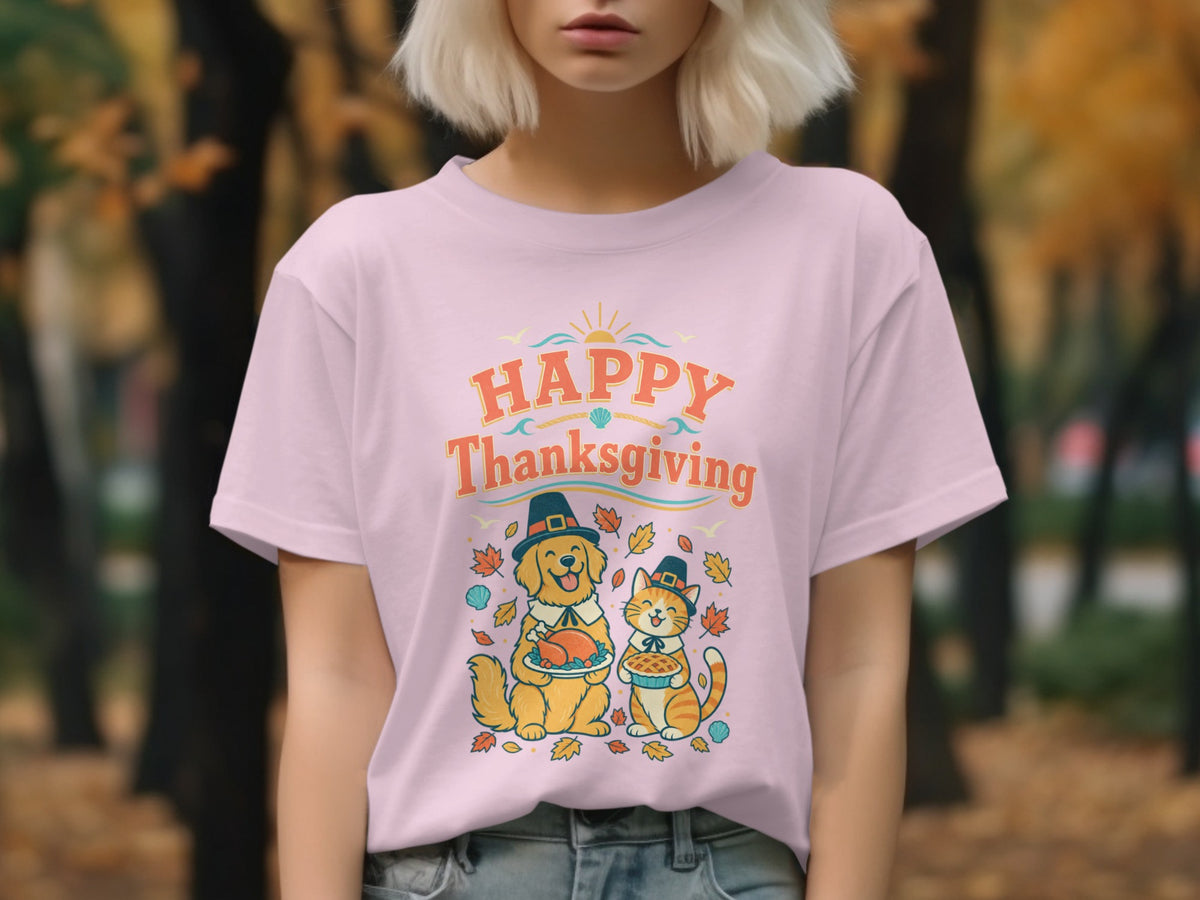 Pink t-shirt with "Happy Thanksgiving" text and illustration of a dog and cat.