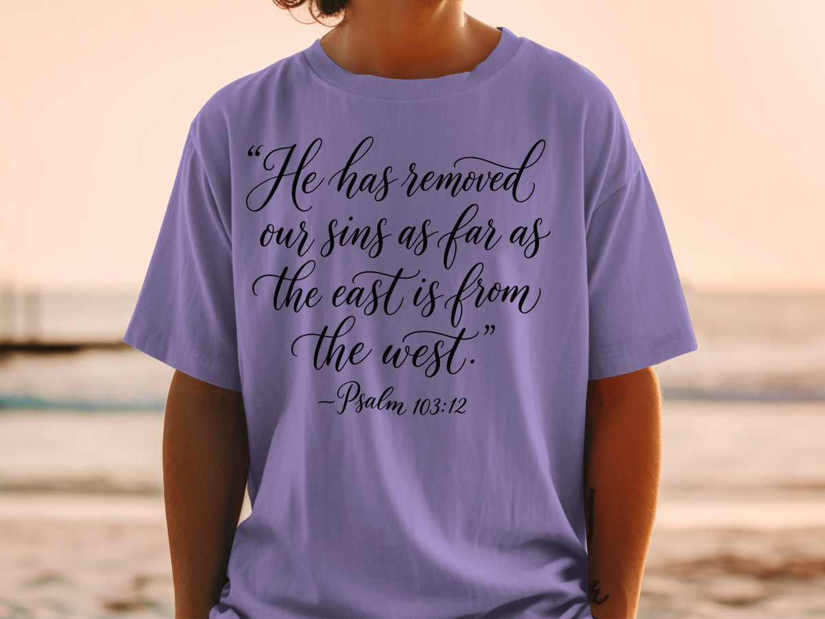 Purple t-shirt with "He has removed our sins as far as the east is from the west." - Psalm 103:12