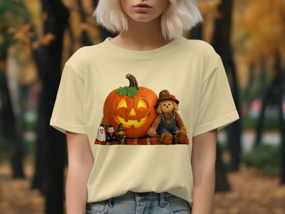 Halloween graphic: jack-o-lantern, scarecrow, ghost, witch, and vampire on plaid blanket.