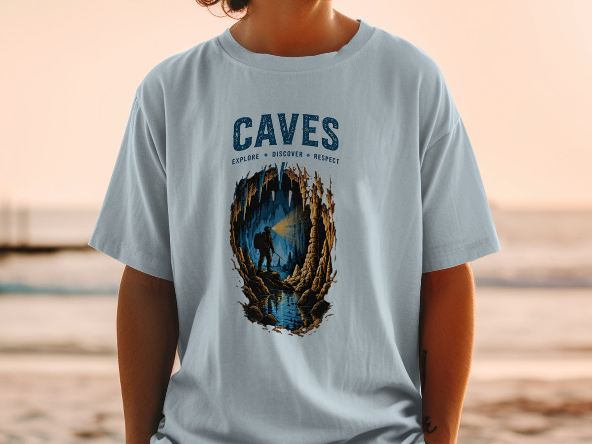 Light blue t-shirt with "CAVES EXPLORE DISCOVER RESPECT" and cave illustration.