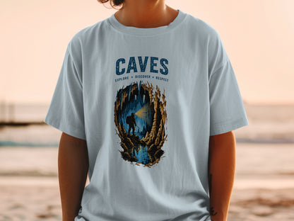 Light blue t-shirt with "CAVES EXPLORE DISCOVER RESPECT" and cave illustration.
