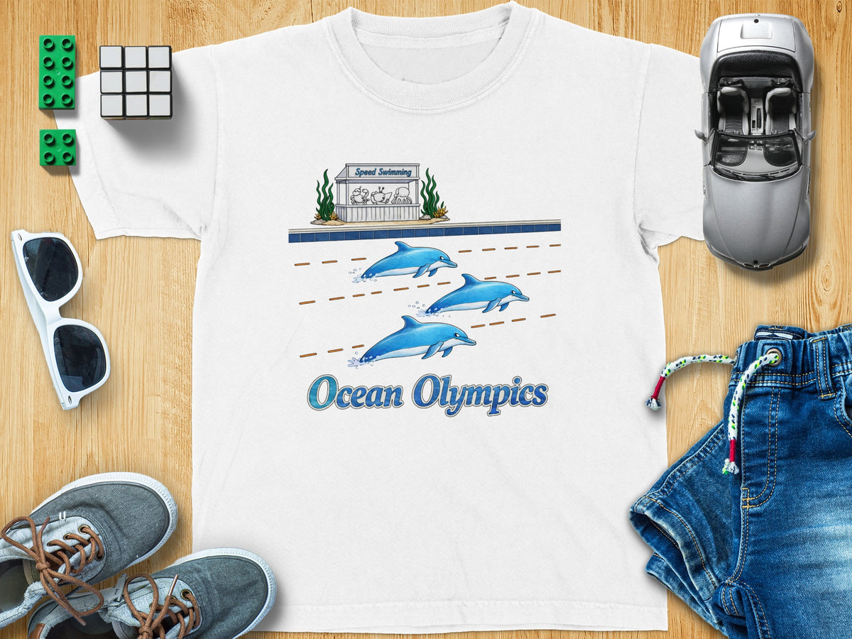 White t-shirt with cartoon dolphins swimming and text "Ocean Olympics".