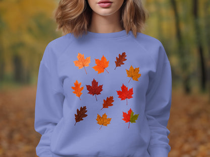 Lavender sweatshirt with an all-over pattern of colorful autumn leaves.
