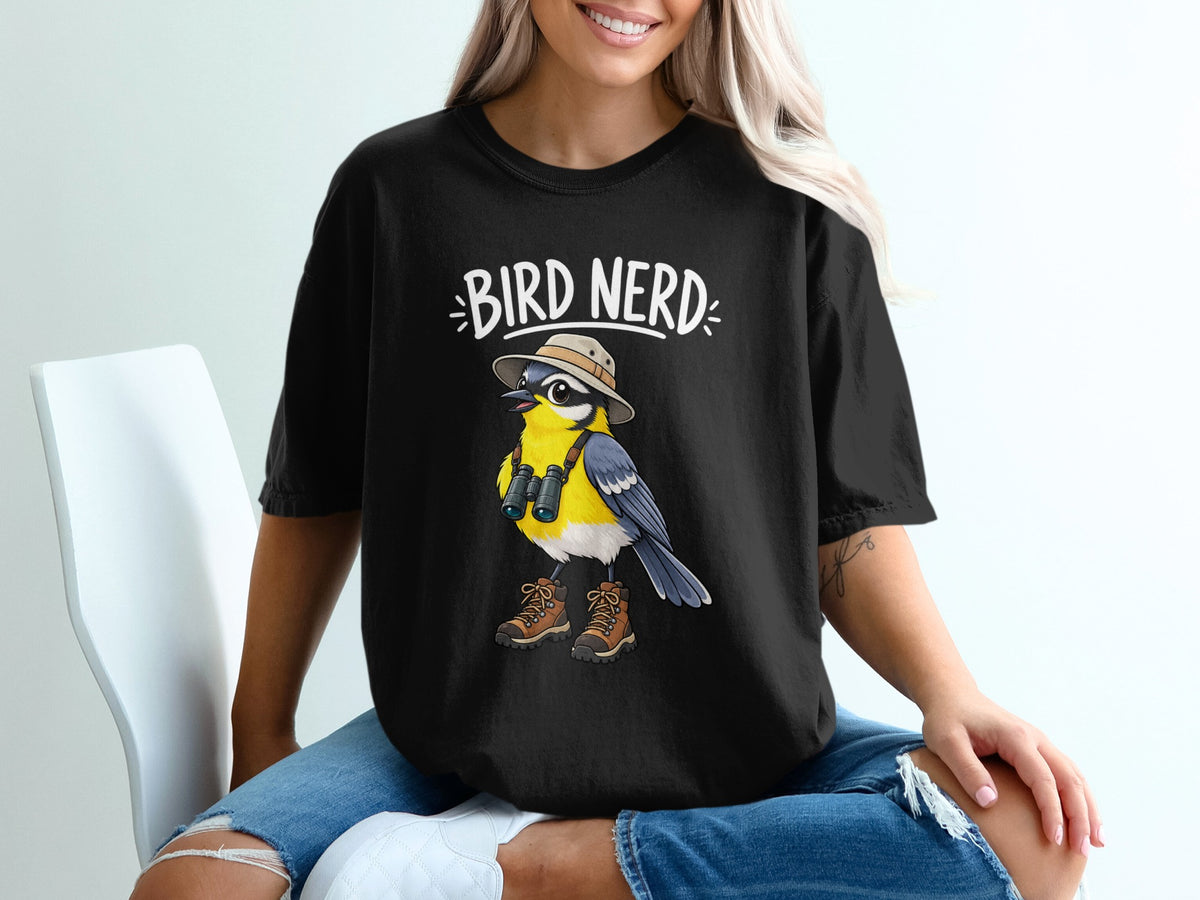Black t-shirt with "BIRD NERD" text and cartoon bird wearing hat, binoculars, and boots.
