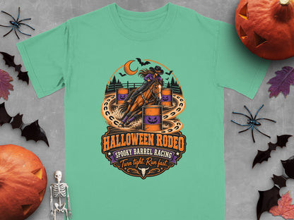 Green t-shirt with "Halloween Rodeo Spooky Barrel Racing Turn tight. Run fast." graphic.