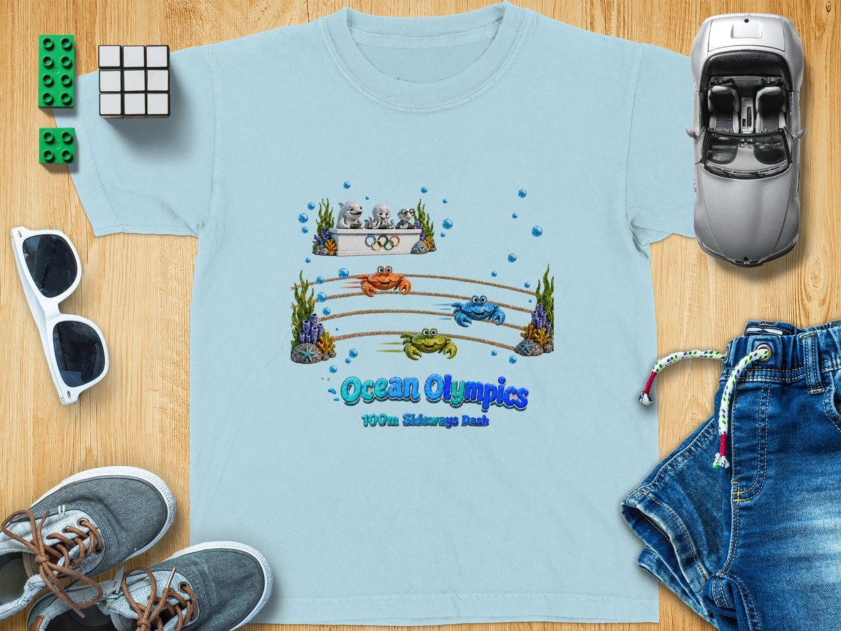 Light blue t-shirt with "Ocean Olympics 100m Sideways Dash" graphic featuring cartoon sea creatures.