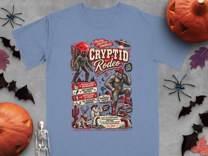 Cryptid Rodeo graphic tee featuring Bigfoot, Mothman, Jackalope, and other cryptids.