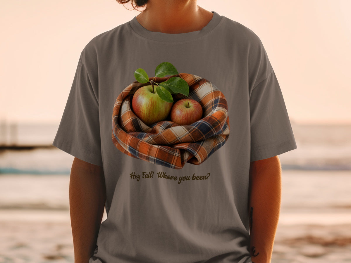 T-shirt with graphic of apples in a plaid scarf and text "Hey Fall! Where you been?"