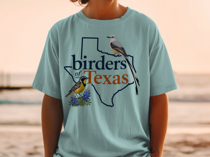 Light blue t-shirt with Texas outline, two birds, and "birders of Texas" text.
