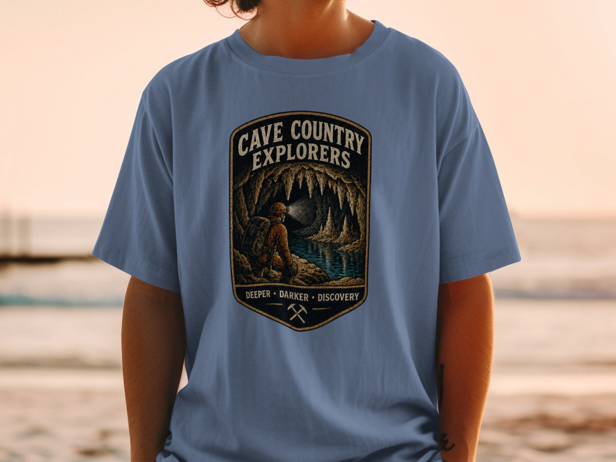 Cave Country Explorers t-shirt with cave art and text: Deeper, Darker, Discovery.