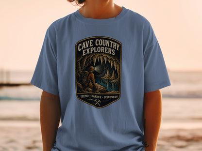 Cave Country Explorers t-shirt with cave art and text: Deeper, Darker, Discovery.