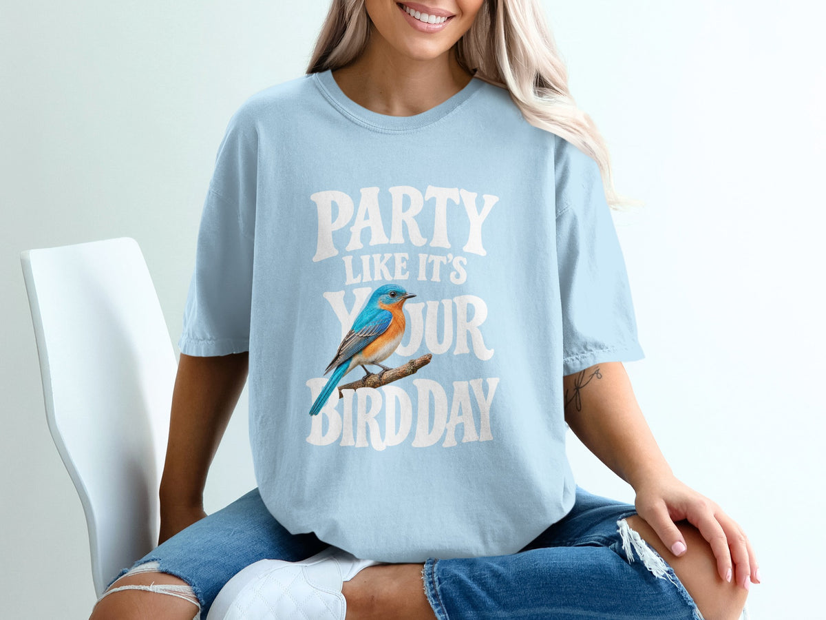 Light blue t-shirt with text "PARTY LIKE IT'S YOUR BIRDDAY" and a blue bird.
