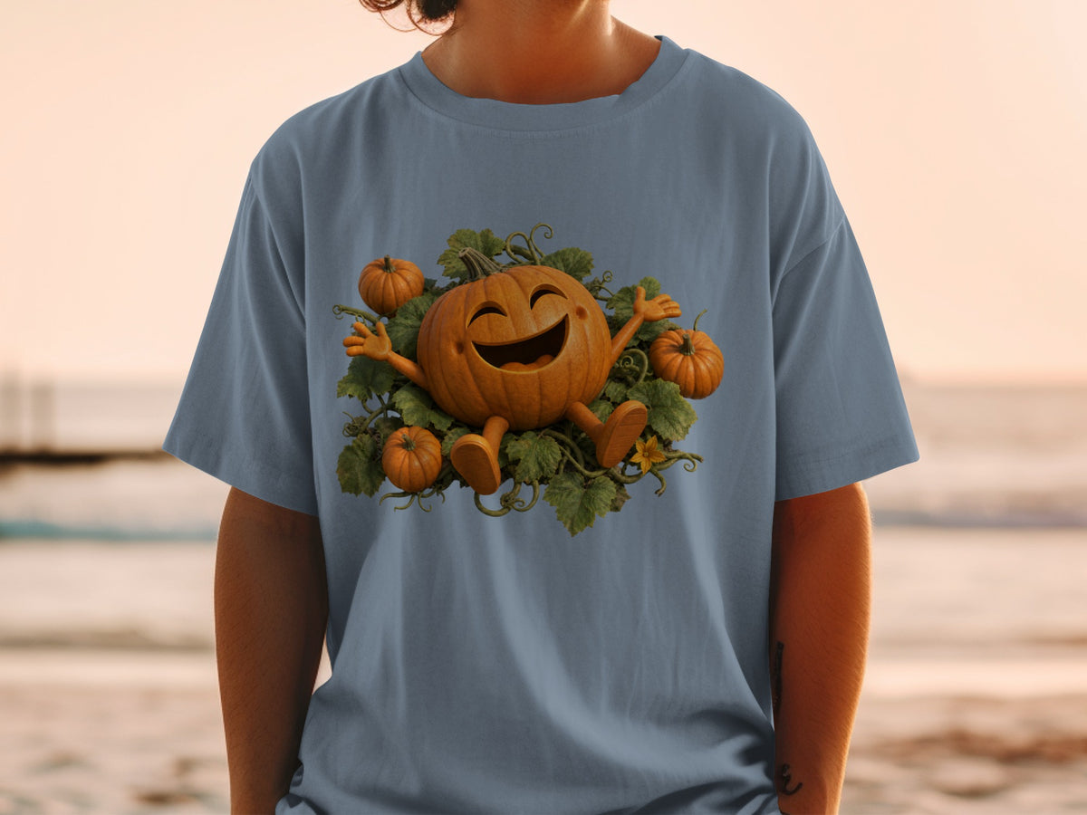 Happy cartoon pumpkin surrounded by smaller pumpkins and vines on a blue t-shirt.