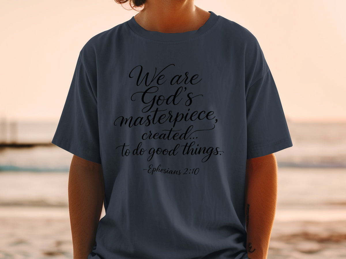 Dark t-shirt with "We are God's masterpiece, created... to do good things. -Ephesians 2:10" text.