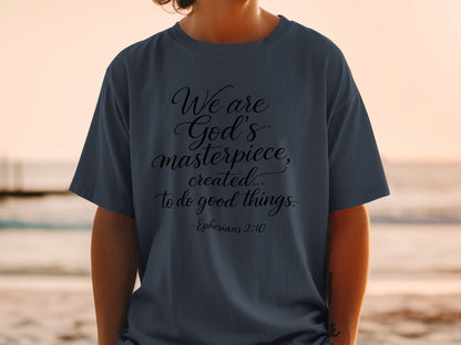 Dark t-shirt with "We are God's masterpiece, created... to do good things. -Ephesians 2:10" text.