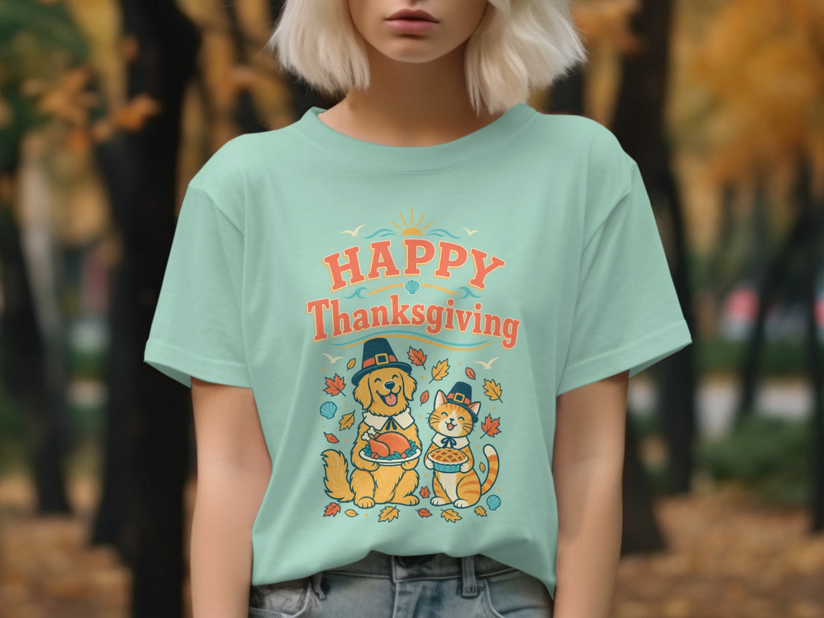 Light blue t-shirt with "Happy Thanksgiving" text, a dog holding turkey, and a cat holding pie.