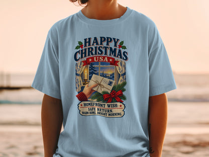 Light blue t-shirt with "Happy Christmas USA" and a holiday scene.