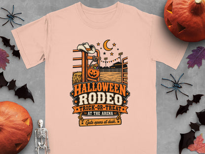 Halloween Rodeo Trick-or-Treat at the Arena graphic on a peach t-shirt.