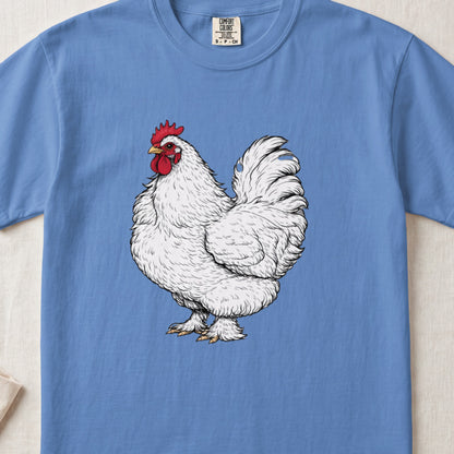 A light blue t-shirt featuring a detailed illustration of a fluffy white rooster with a red comb.