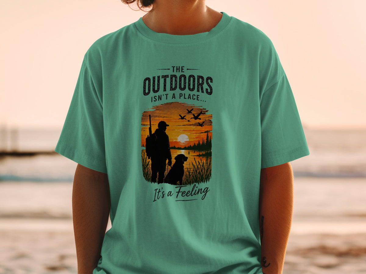 T-shirt graphic with text "The Outdoors Isn't a Place... It's a Feeling."