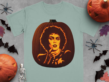 A sage green t-shirt features a carved pumpkin graphic of Frank-N-Furter from The Rocky Horror Picture Show.