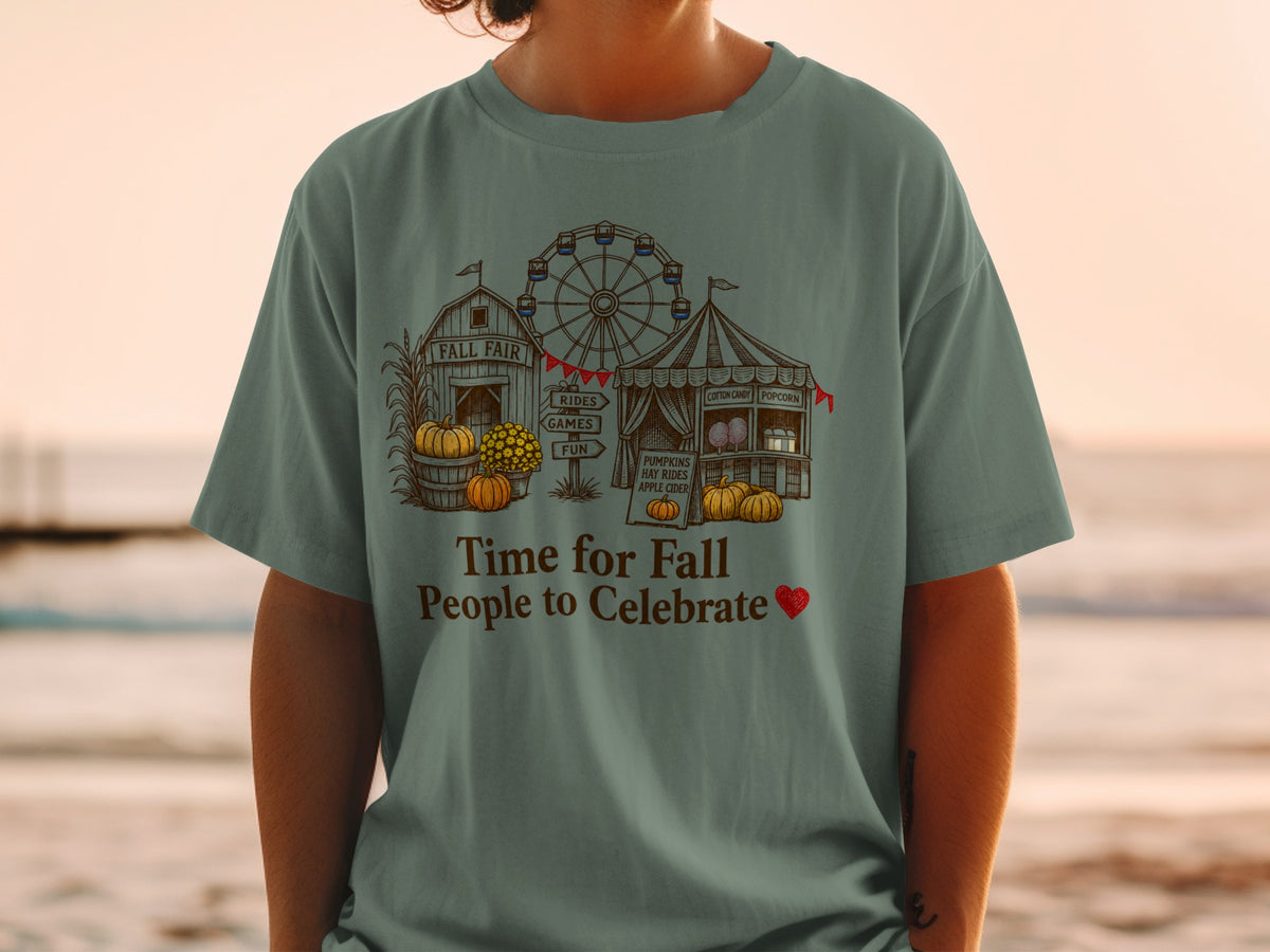 T-shirt with fall fair scene including Ferris wheel, tent, barn, pumpkins, and text.